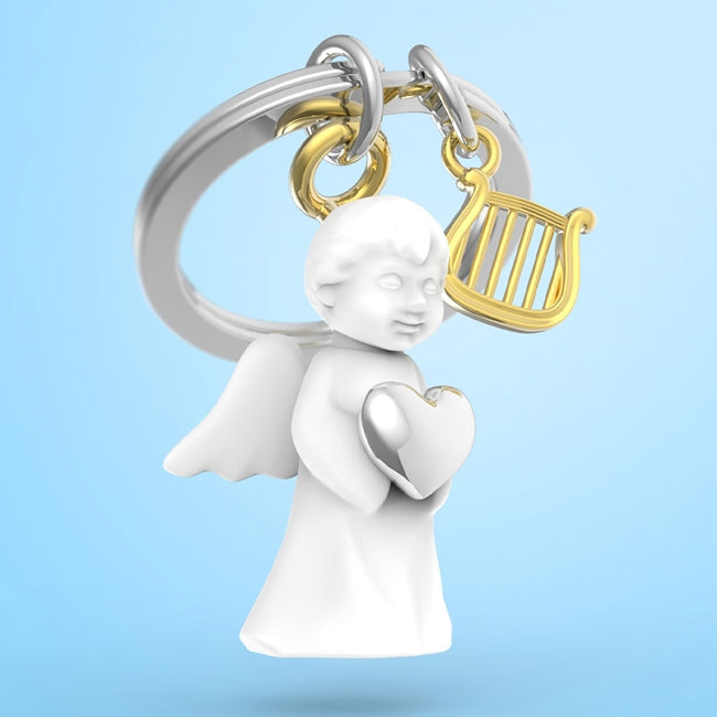 Metalmorphose.lt metalinis raktų pakabukas ANGELAS SARGAS. Metalinis angelas su širdelė ir auksine arfa. Premium simbolinė miniatiūra iš SIMBOLIŲ PASAULIS kolekcijos.