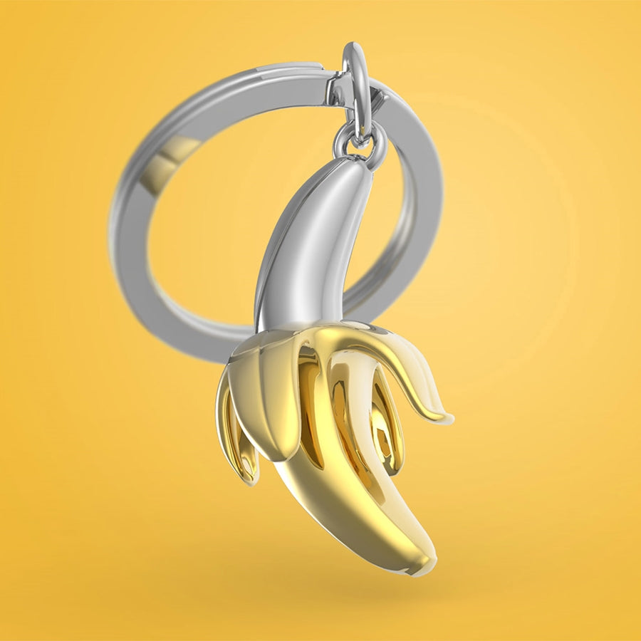 Metalmorphose.lt metalinis raktų pakabukas „Auksinis Bananas“ – auksinio banano 3D miniatiūra iš Skonių Pasaulis kolekcijos.