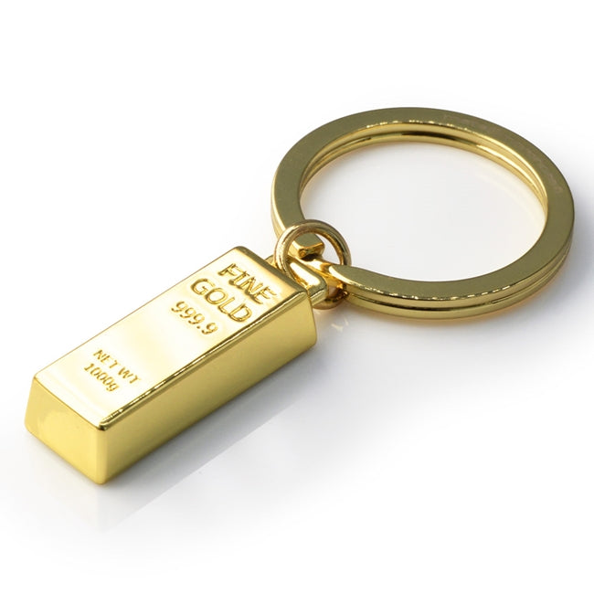 Metalmorphose.lt metalinis raktų pakabukas AUKSO LUITAS. Metalinis korpusas, nudažytas aukso tonas, 3D aukso luito miniatiūra su ženklinimu. Nerūdijančio plieno žiedas. Pakabukas iš KASDIENYBĖS PASAULIS kolekcijos.