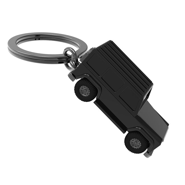 Metalmorphose.lt metalinis raktų pakabukas GALINGASIS G-WAGON. Tvirtas 3D visureigis su reljefiniu kėbulu ir judančiais guminiais ratais. TRANSPORTO PASAULIS kolekcija.