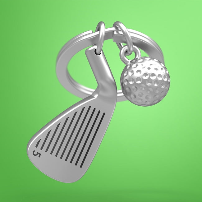 Metalmorphose.lt metalinis raktų pakabukas GOLFO DVASIA. 3D metalinis golfo lazdos galas ir detalus metalinis golfo kamuoliukas, premium cinko lydinys, plieno žiedas. SPORTO PASAULIS kolekcija.