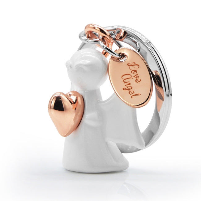 Metalmorphose.lt metalinis raktų pakabukas MEILĖS ANGELAS. Metalinis angelas su rose gold lentele „Love Angel“. Premium simbolinė miniatiūra iš SIMBOLIŲ PASAULIS kolekcijos.