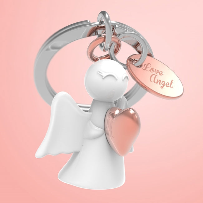 Metalmorphose.lt metalinis raktų pakabukas MEILĖS ANGELAS. Metalinis angelas su rose gold lentele „Love Angel“. Premium simbolinė miniatiūra iš SIMBOLIŲ PASAULIS kolekcijos.