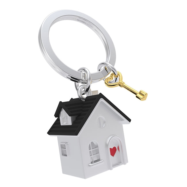 Metalmorphose.lt metalinis raktų pakabukas NAMAI NAMUČIAI. Metalinis namelis su širdies simboliu, nudažytas akcentas, 3D namų ir rakto miniatiūra. Nerūdijančio plieno žiedas. Pakabukas iš KASDIENYBĖS PASAULIS kolekcijos.