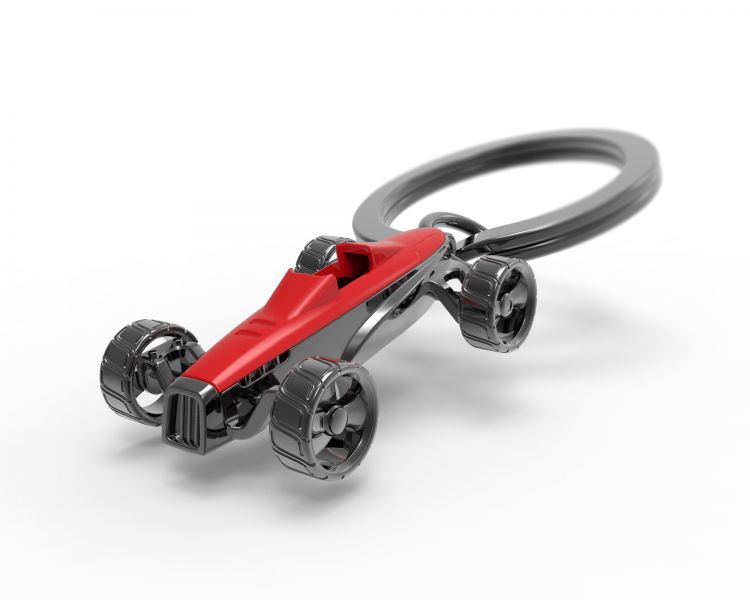 Metalmorphose.lt metalinis raktų pakabukas RAUDONASIS BOLIDAS. Ryškiai raudonas sportinis automobilis su besisukančiais détaileis ratais ir aerodinaminiu korpusu. TRANSPORTO PASAULIS kolekcija.