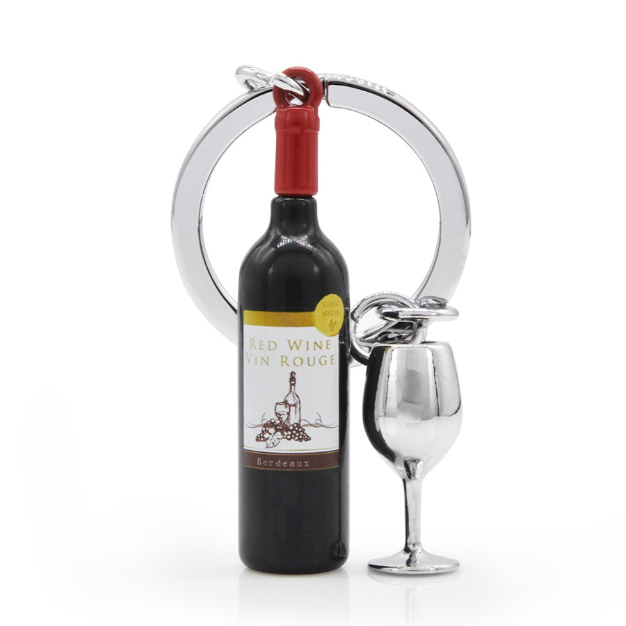 Metalinis raktų pakabukas „Raudonas Vynas“ su vyno butelio ir taurės 3D dizainu iš Metalmorphose SKONIŲ PASAULIS kolekcijos.